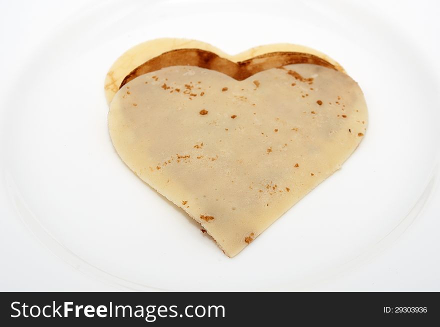 Heart-shaped Pancakes On White