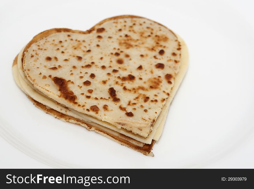 Heart-shaped Pancakes On White