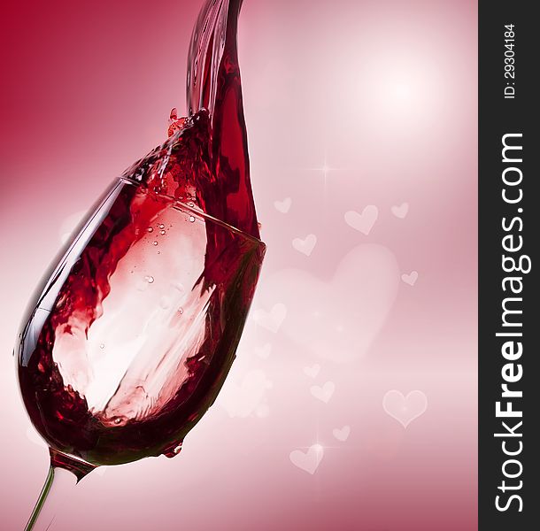 Glass of red wine on vintage background