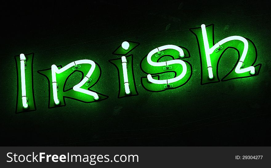 Irish word in green neon with dark background
