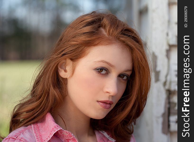 An up close portrait of a pretty red haired woman. An up close portrait of a pretty red haired woman