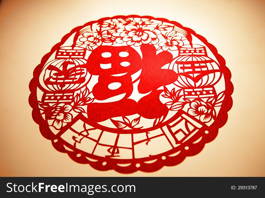 Chinese paper cutting-character FU upside down means that happiness has come up