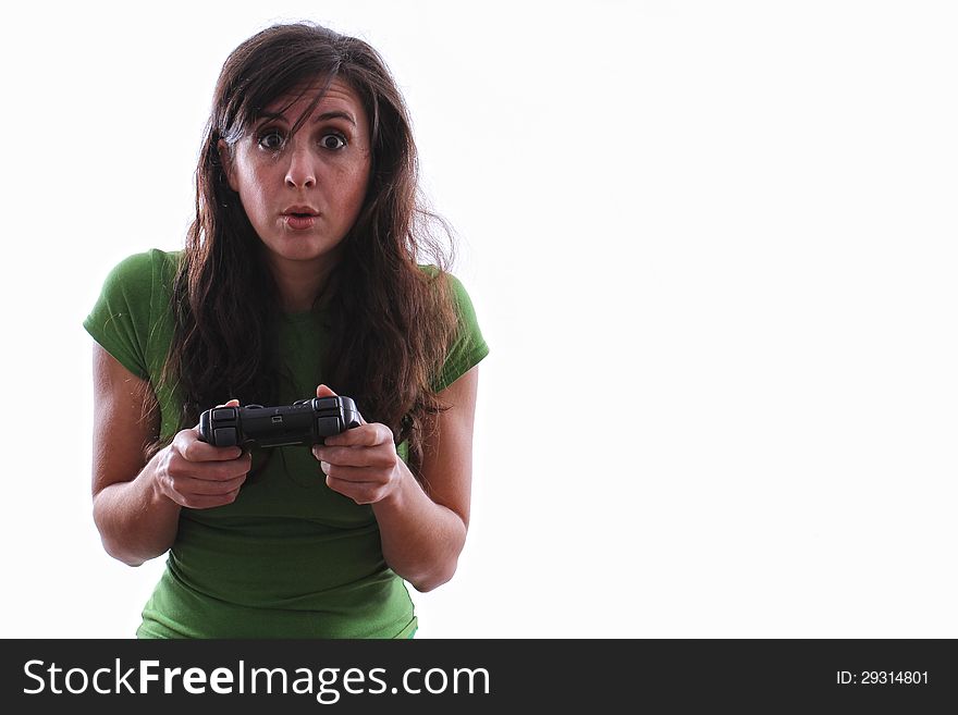 Caucasian woman hold a console remote is surprised at what she sees. Caucasian woman hold a console remote is surprised at what she sees