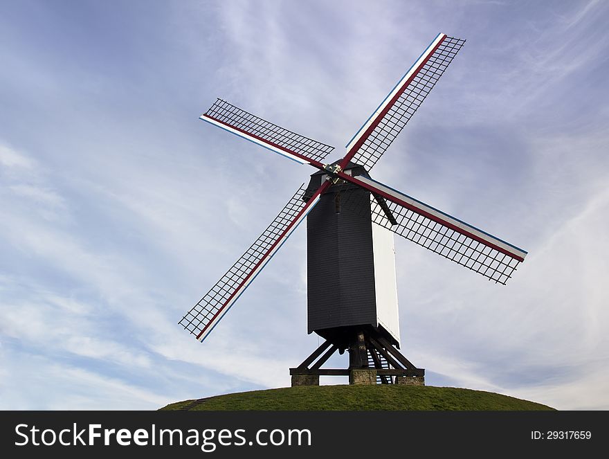 The famous old windmills from Brugge (Bruges) in Flanders Belgium, with a beautiful blue sky in the background. The famous old windmills from Brugge (Bruges) in Flanders Belgium, with a beautiful blue sky in the background.