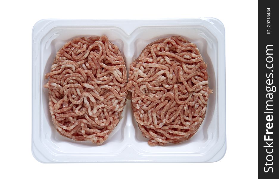 Two raw cutlets in a plastic pack isolated on white. Two raw cutlets in a plastic pack isolated on white