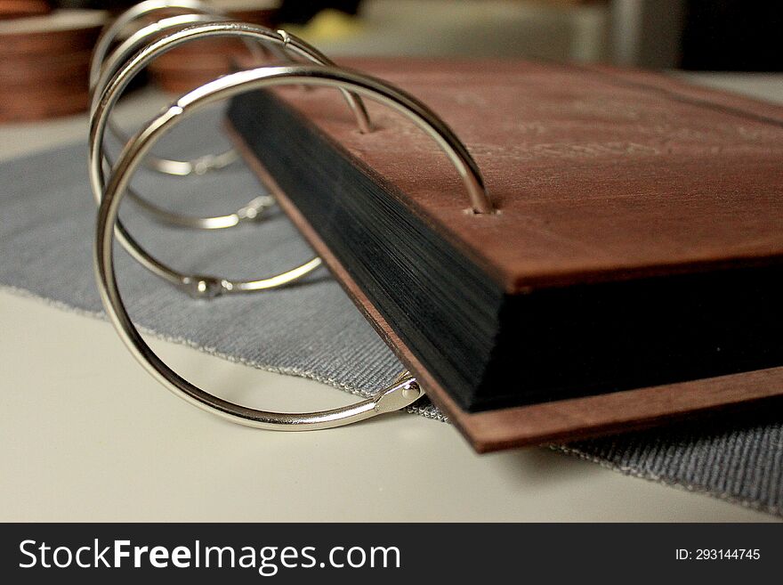 Vintage wood book on the table. Book on a desk. old wooden book. Photoalbum album. ring mechanism for a book