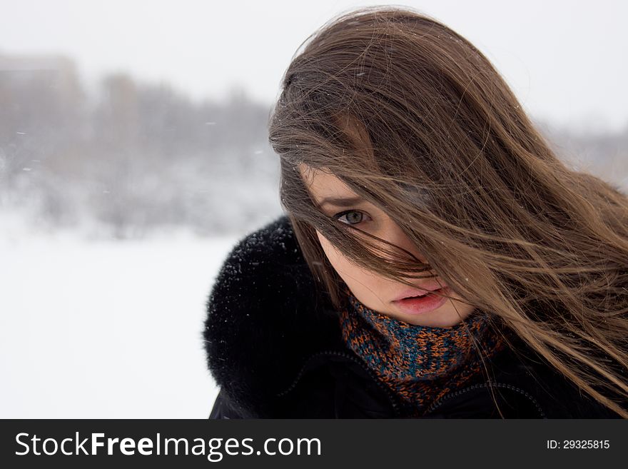 Portrait of a girl outdoors in winter. Portrait of a girl outdoors in winter.