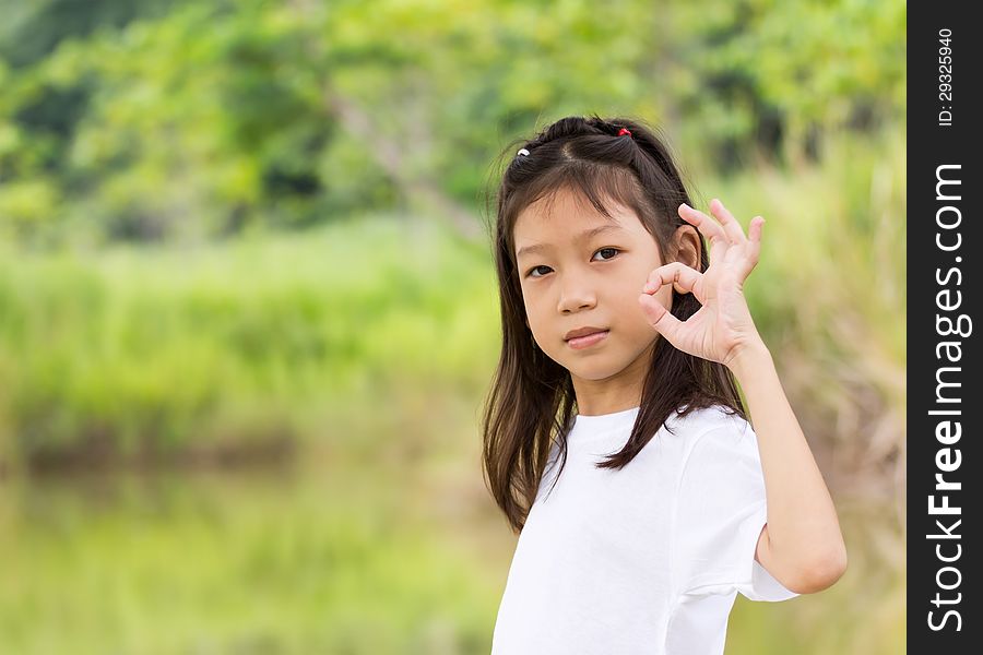 Outdoors portrait of beautiful Asian young girl. Outdoors portrait of beautiful Asian young girl