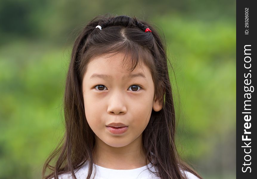 Outdoors portrait of beautiful Asian young girl. Outdoors portrait of beautiful Asian young girl