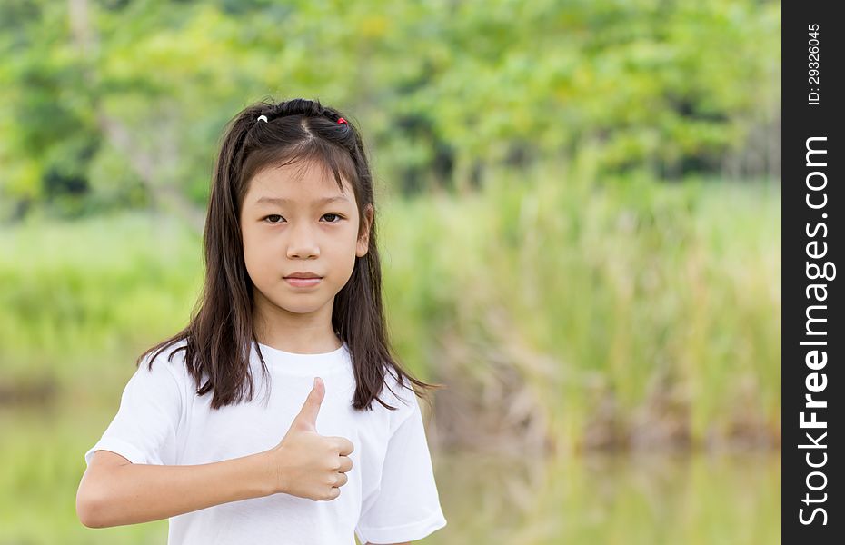 Outdoors portrait of beautiful Asian young girl. Outdoors portrait of beautiful Asian young girl