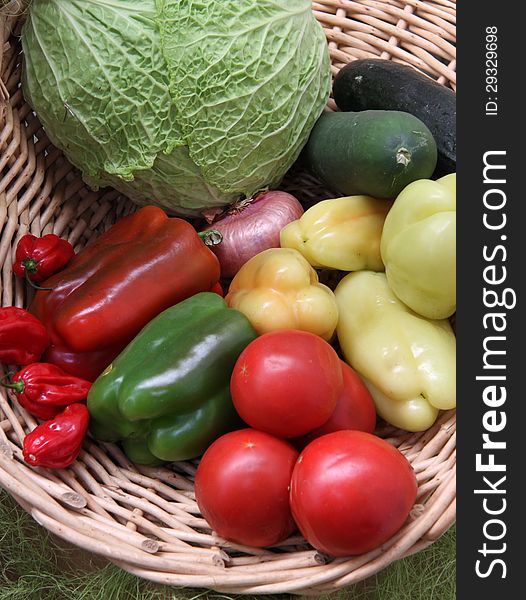 Some fresh vegetables fruit from home garden in to the basket made from organic material