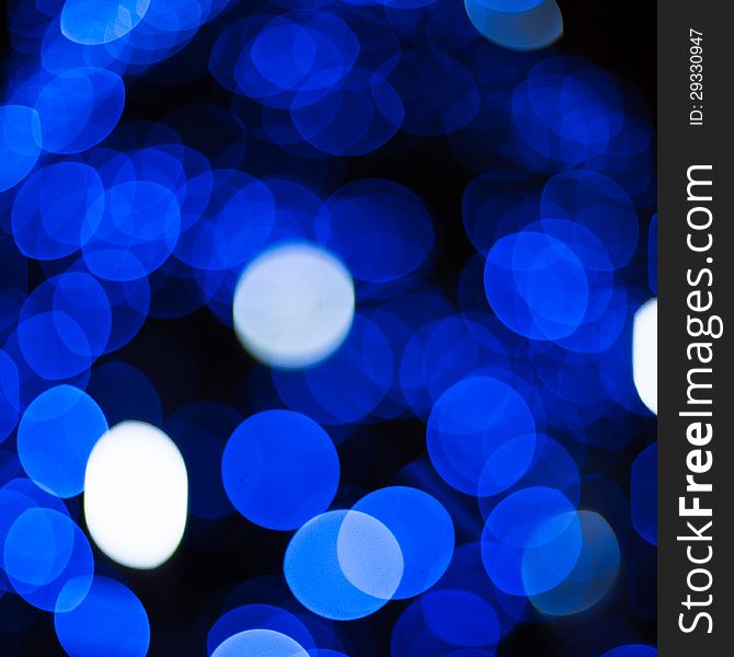 Defocused abstract blue new year lights background. Defocused abstract blue new year lights background
