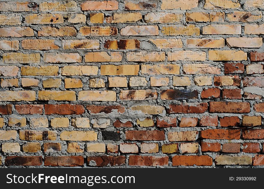 Aged brick wall background. High resolution texture