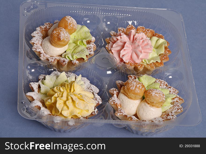 Beautiful cakes with cream in a box. Beautiful cakes with cream in a box.