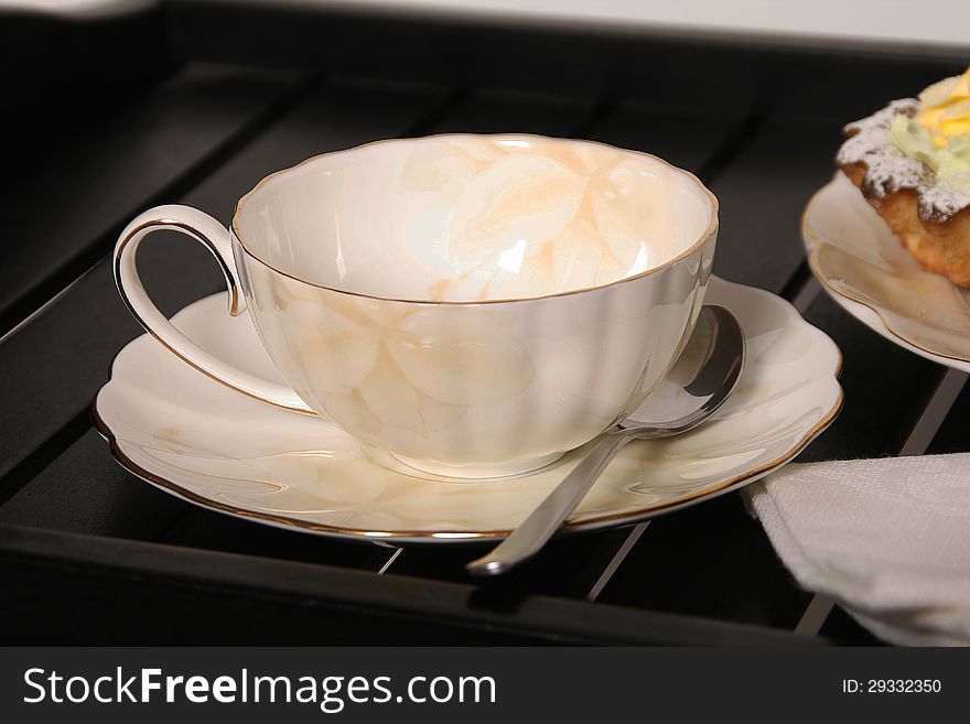 Bautiful porcelain tea cup on table.