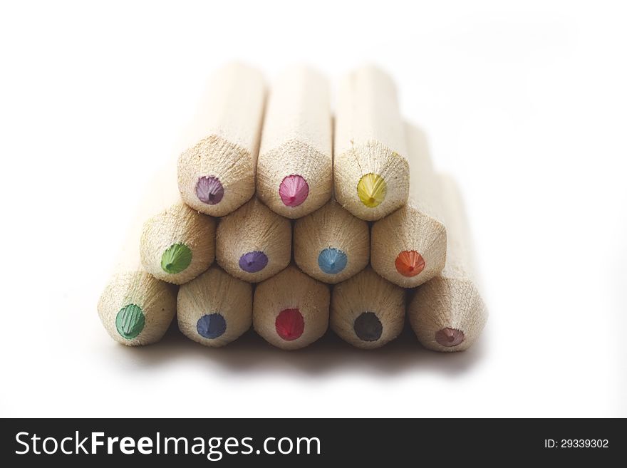 Macro shot of multicolour wooden ecology crayon isolated on white. Macro shot of multicolour wooden ecology crayon isolated on white