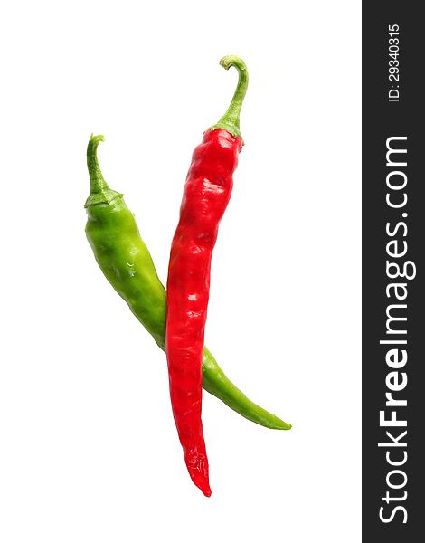 Ripe, red and green chilis isolated on a white background.