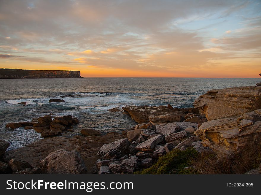 Sunset and rock beach