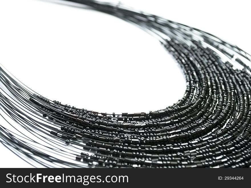 Black beaded necklace on white background. Black beaded necklace on white background