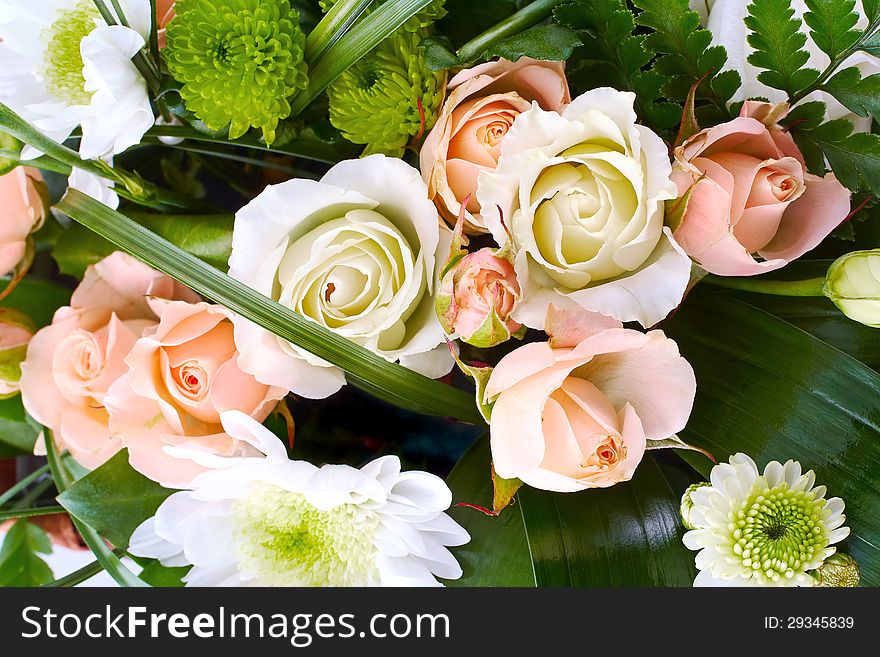 Bouquet of roses and chrysanthemums in composition, closeup