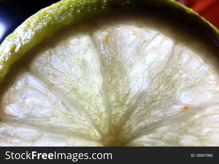 Two whole limes, one half lime, with leaves, on white. Two whole limes, one half lime, with leaves, on white