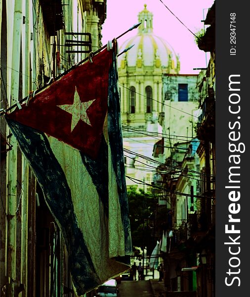 Typical old Havana street with a vintage flag, Cuba.