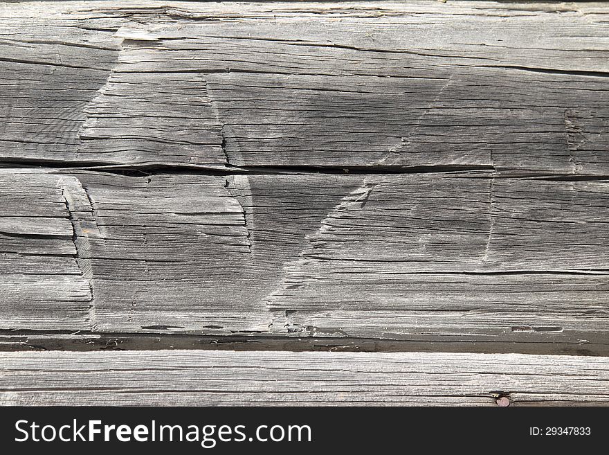 Old weathered hand hewn cabin logs background