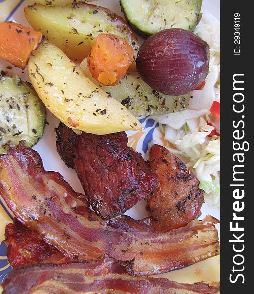 Calorie lunch, grilled meat, bacon and vegetables
