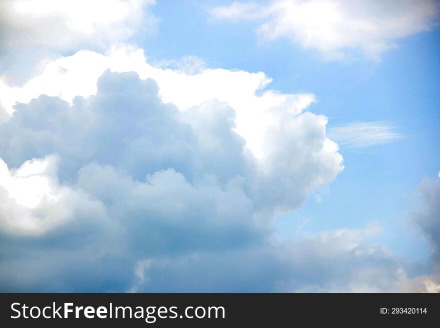 blue sky with white clouds and sun ray, nature cloudscape background. blue sky with white clouds and sun ray, nature cloudscape background