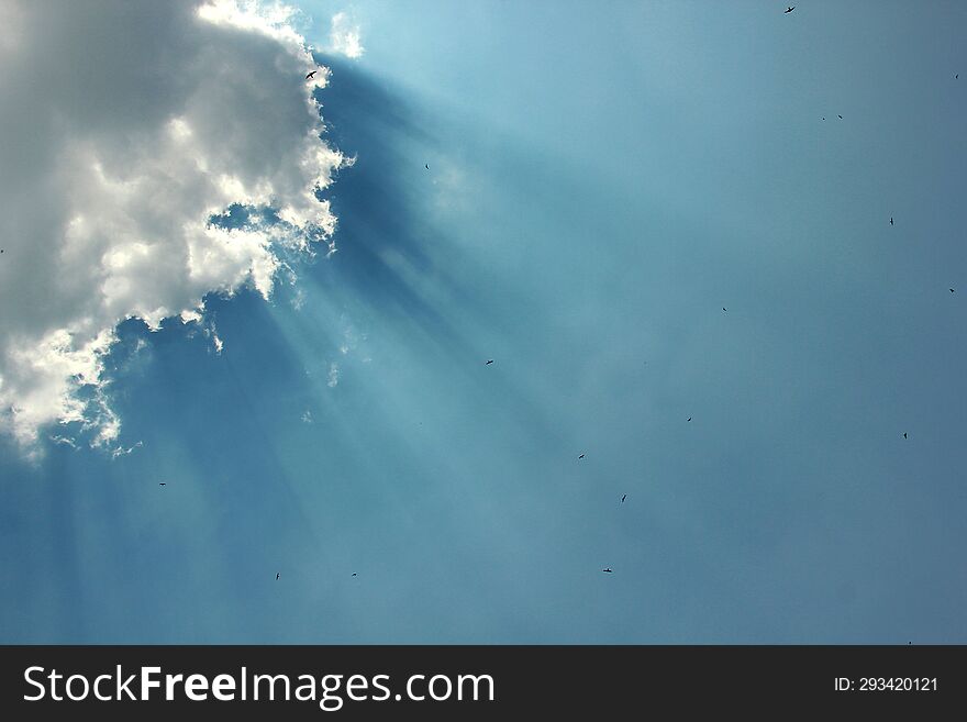 Sun Ray With Blue Sky And Dark White Clouds