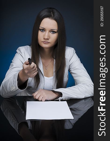 A business woman at a meeting table. A business woman at a meeting table.