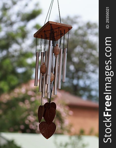 An old wind chimes hanging in the backyard