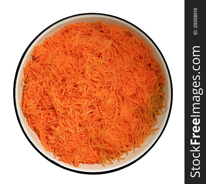 Grated carrots in a large round bowl. Grated carrots in a large round bowl
