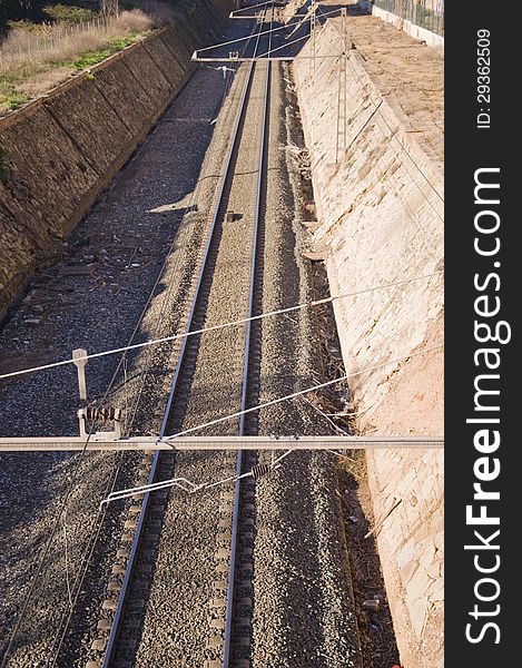 A photo of train tracks taken from a bridge