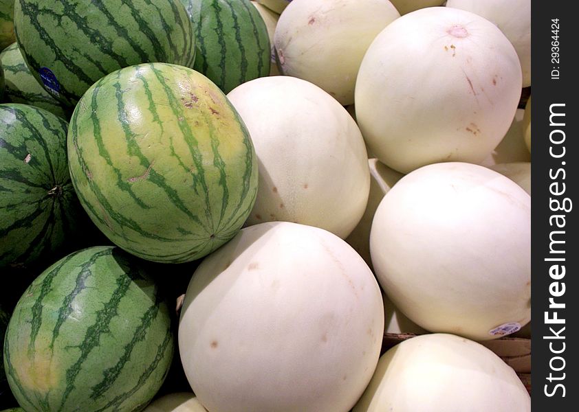 Melons on display in a market.