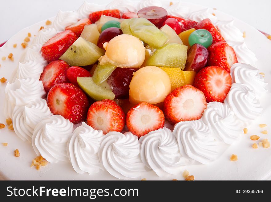 Fruit cake close-up with cream