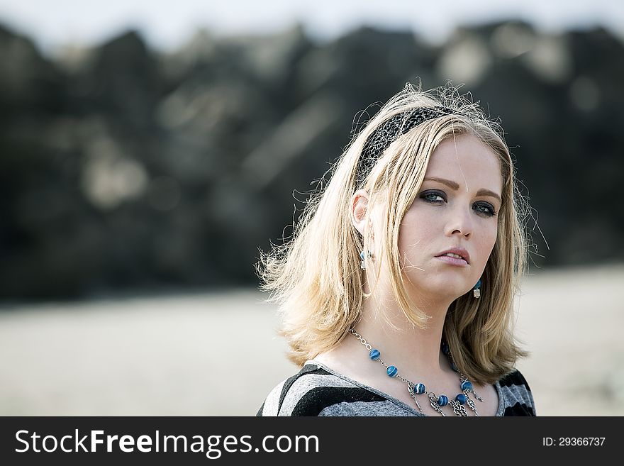 Portrait of a young woman at the beach. Portrait of a young woman at the beach.