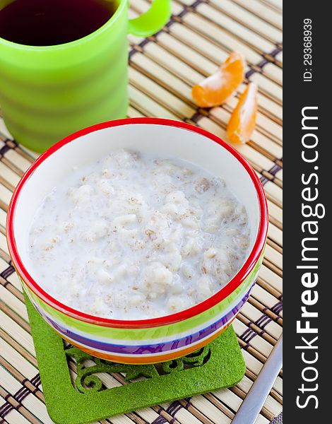 Healthy low-fat breakfast with wholegrain porridge and milk. Healthy low-fat breakfast with wholegrain porridge and milk