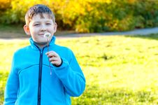 Child Blowing Dandelion Stock Images