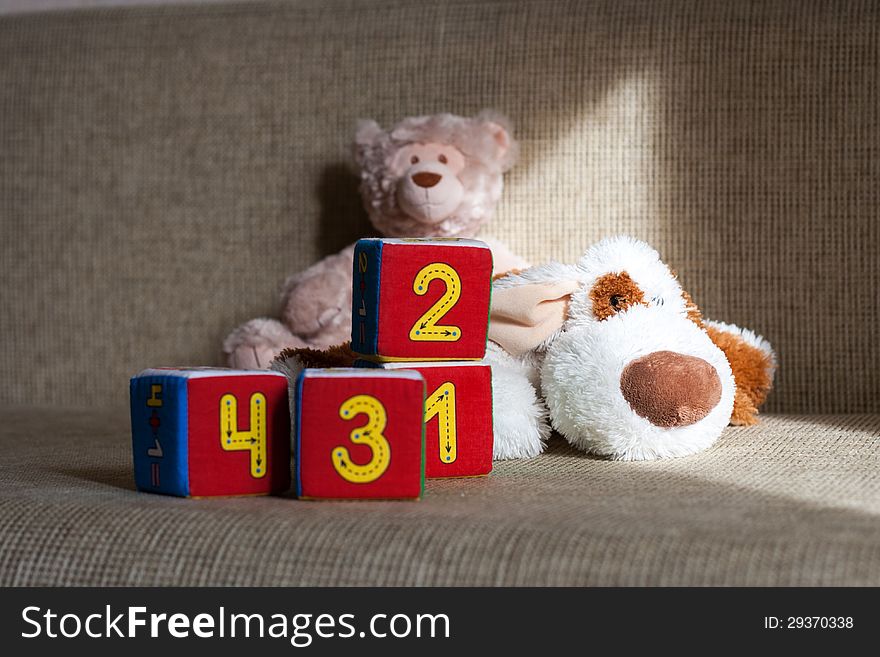 Teddy bear and cubes with number