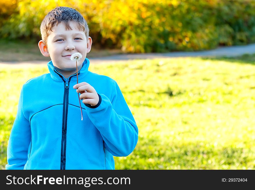 Child blowing Dandelion