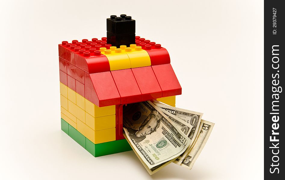 LEGO house and money. Dollars out of the window.