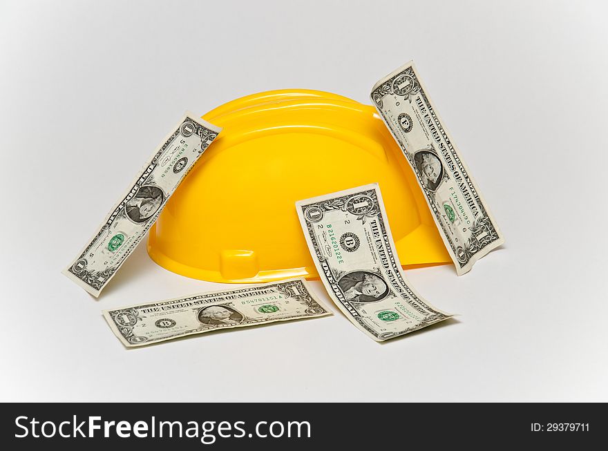 Dollars on the yellow helmet. Business objects. Dollars on the yellow helmet. Business objects.