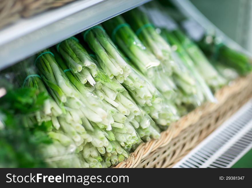 HEAP OF GREEN ONION IN SUPERMARKET. See my other works in portfolio.