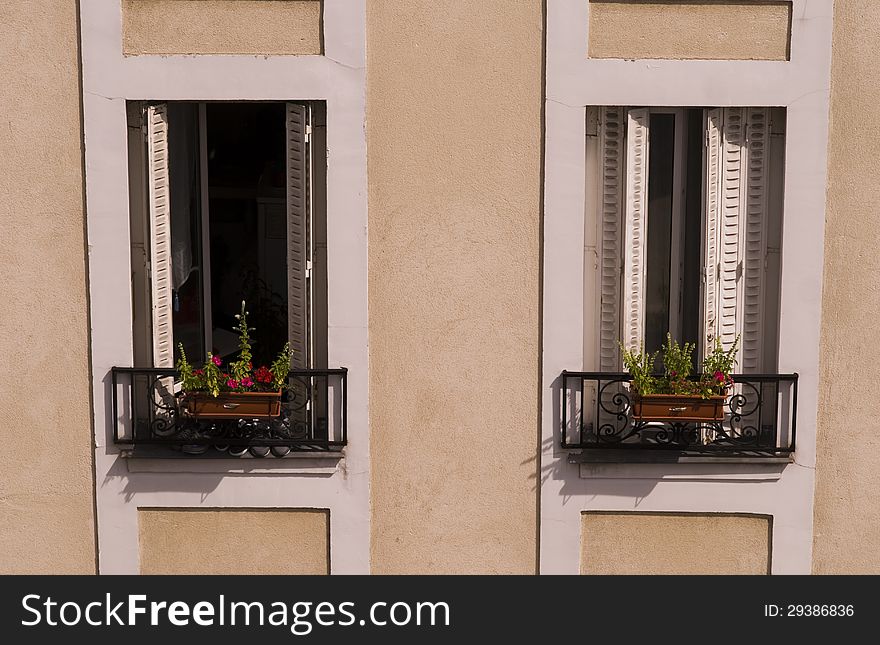 Typical french windows in building in Paris, France