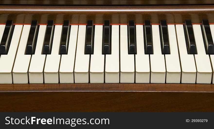 Closeup of Piano Keys on 60's instrument.