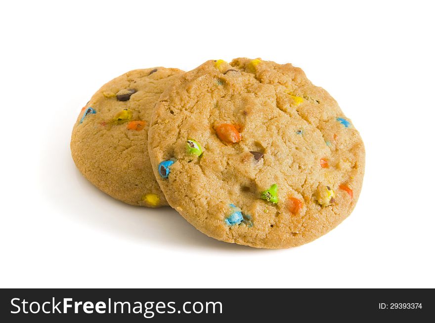 Two candy chip cookies on white background - with selective focus on the foreground