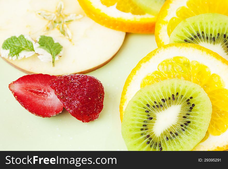 Sliced orange, apple, kiwi fruits and strawberry. Sliced orange, apple, kiwi fruits and strawberry