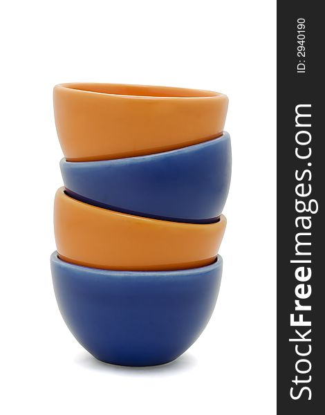 Orange and blue stacked cups isolated on white. Orange and blue stacked cups isolated on white.