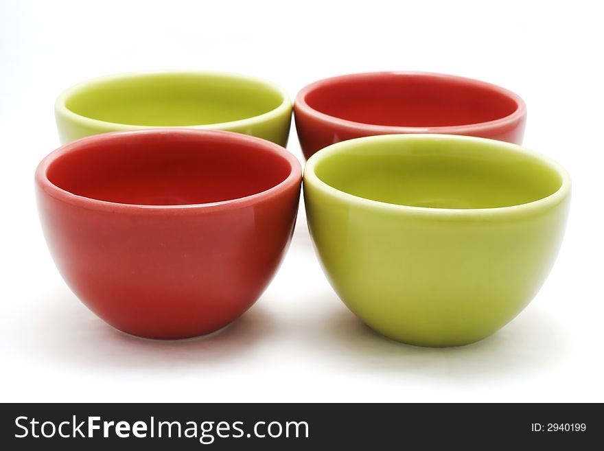 Green and red cups isolated on white. Green and red cups isolated on white.